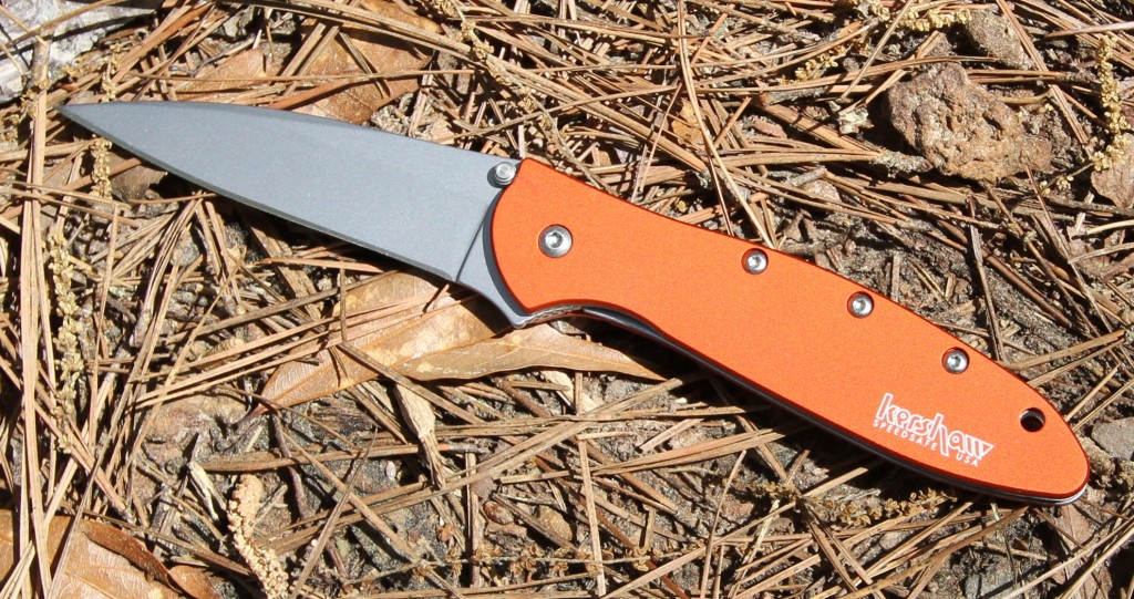 Kershaw Orange Leek 1660 laying in pine straw