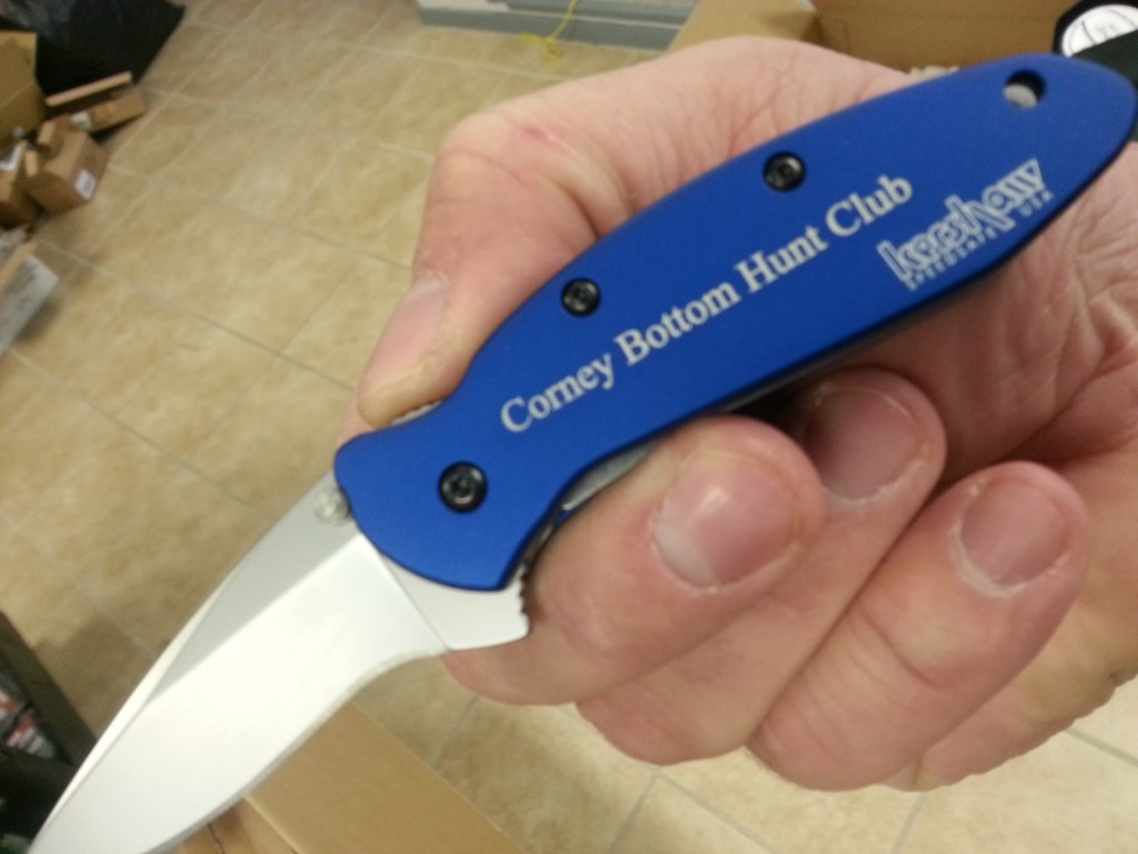 Laser engraving on blue Kershaw Scallion handle